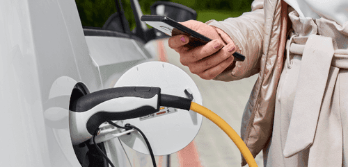 EV owner checking current vehicle charge state using their smartphone