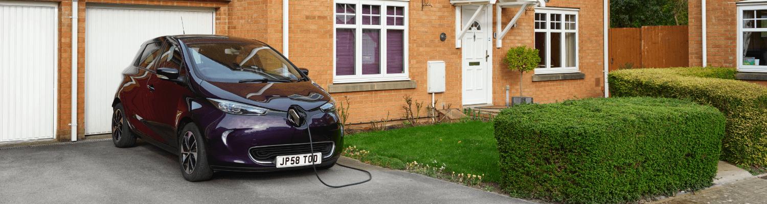 Renault Zoe plugged in on a driveway