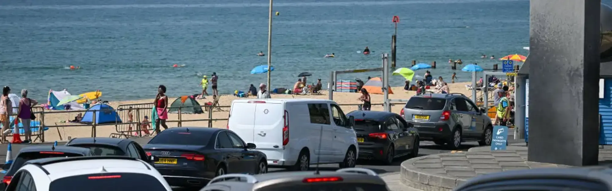 Vehicles in queue at seaside because of heatwave