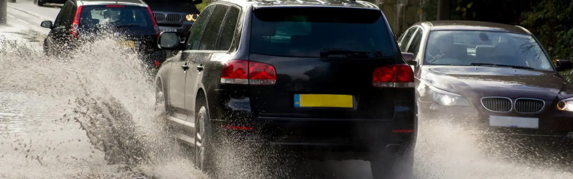 Car driving through flood